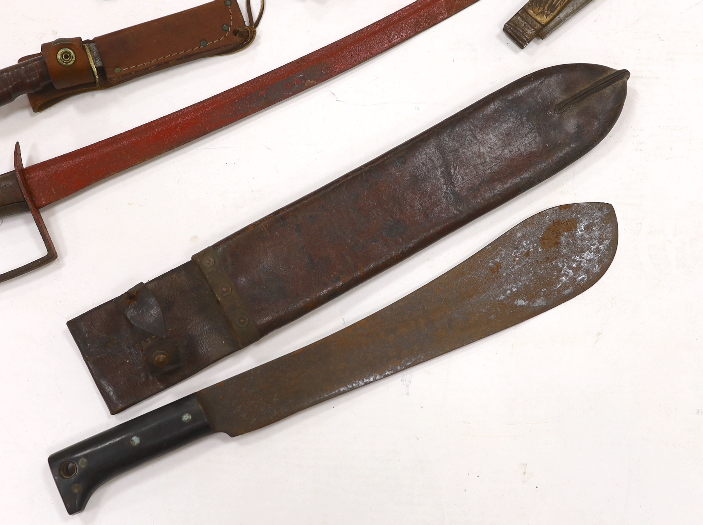 A continental cavalry trooper’s sword c.1780, together with a Legitimus Parang dated 1940 and four other assorted hunting knives